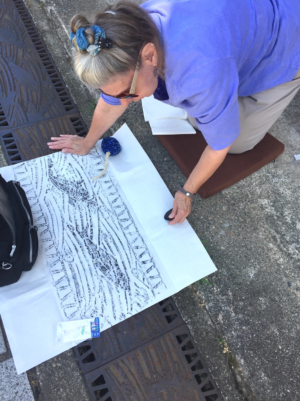 Barbara doing a brass rubbing on the Inami craft street