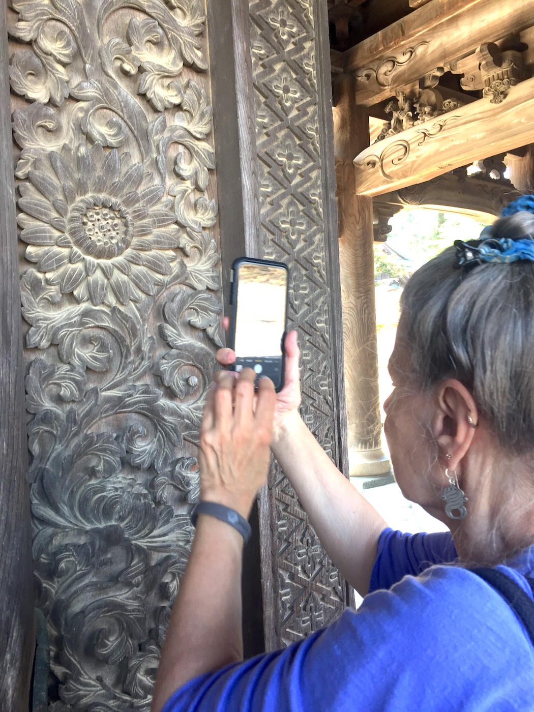 Barbara photographing the intricate Zuisenji temple carvings